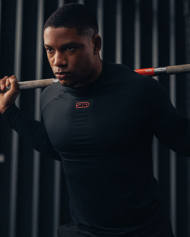 SBD Classic Refresh - athlete in black long sleeve unracking a barbell